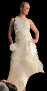 This is an amazing wedding dress composed of plastic twist ties and plastic bags. The model is Erin Frolander who partnered with Lynn Dixon to make this lovely design. The received fifth place.